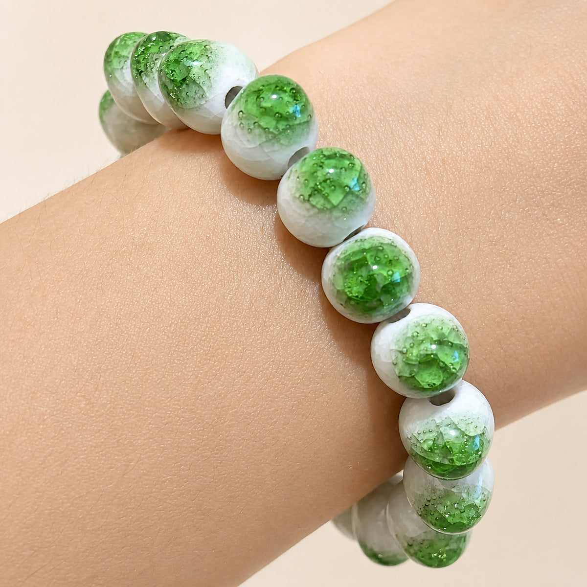 LUMI green ice-crackle glaze ceramic bracelet 10mm — close-up of glaze texture and hand-finished beads