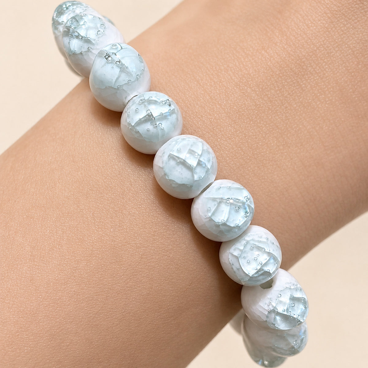LUMI sky blue ice-crackle glaze ceramic bracelet 10mm — close-up of glaze texture and hand-finished beads