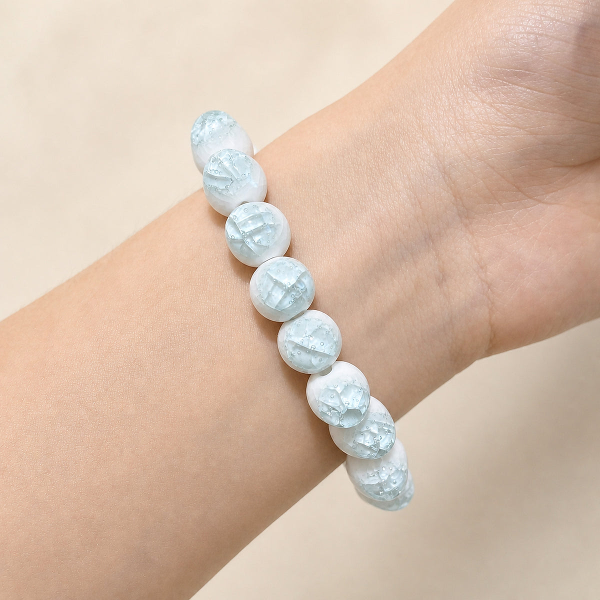 LUMI sky blue ice-crackle glaze ceramic bracelet 10mm worn on the wrist — handmade Jingdezhen porcelain, wrist shot 3