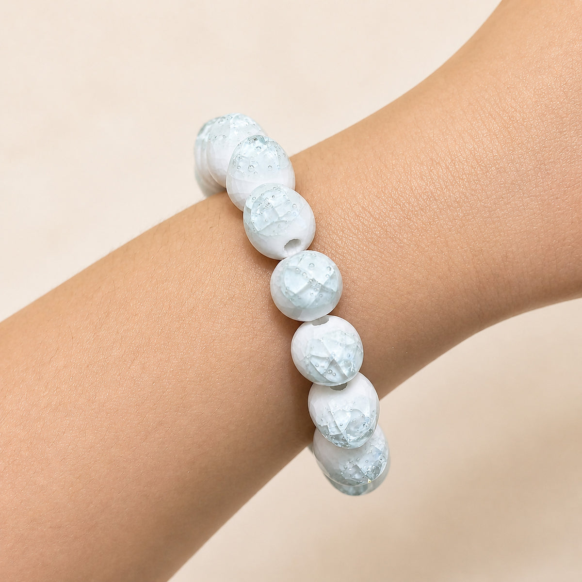 LUMI sky blue ice-crackle glaze ceramic bracelet 10mm worn on the wrist — handmade Jingdezhen porcelain, wrist shot 4