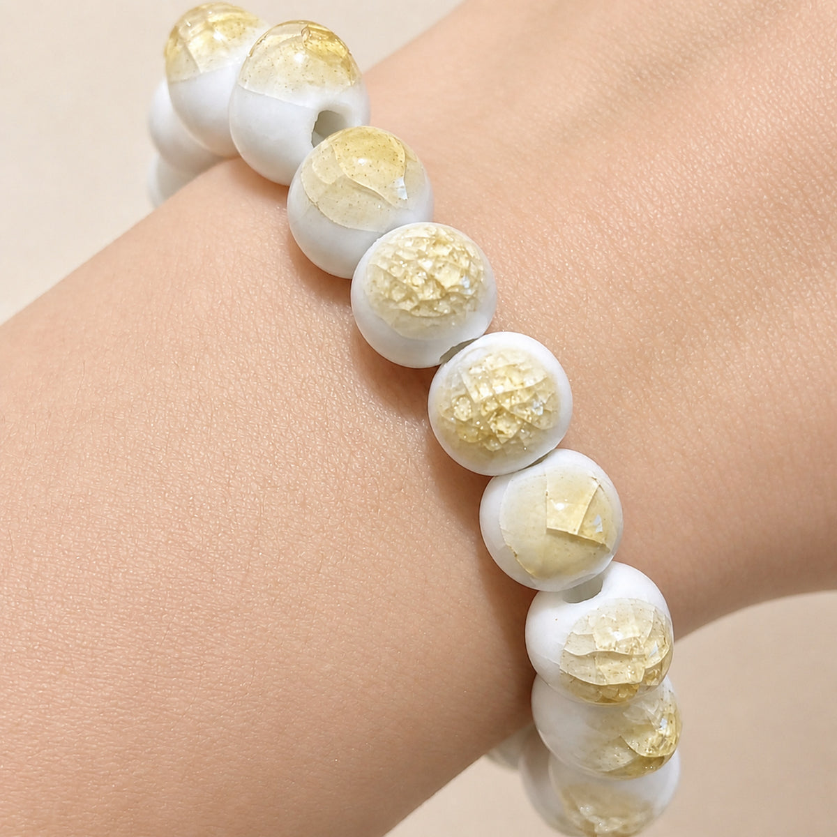 LUMI yellow ice-crackle glaze ceramic bracelet 10mm — close-up of glaze texture and hand-finished beads