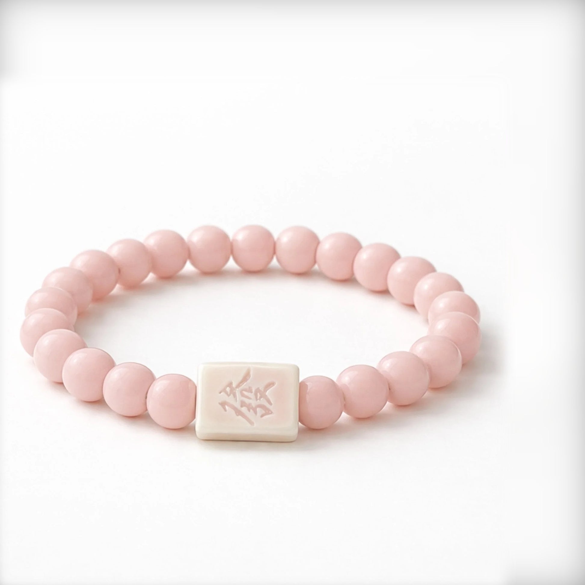 LUMI FA Character pink ceramic bracelet with engraved 發 porcelain bead — handcrafted in Jingdezhen