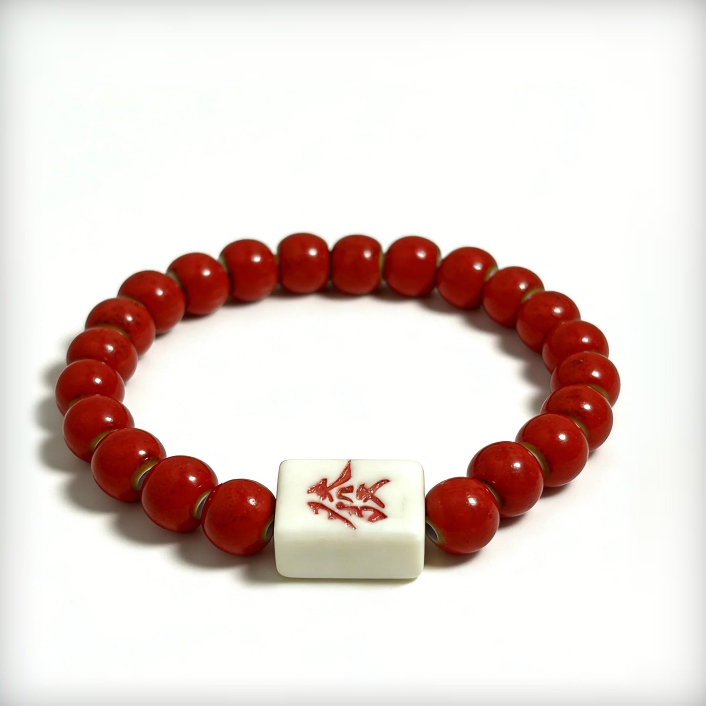 LUMI FA Character red ceramic bracelet — angled view showing hand-painted 發 porcelain bead