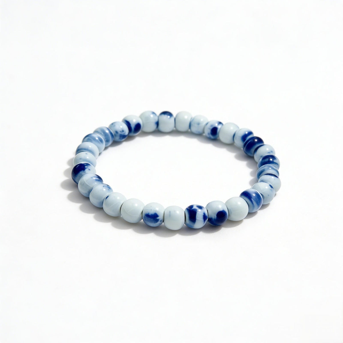 LUMI handmade Jingdezhen blue-and-white (qing hua) porcelain ceramic bead bracelet, 6mm, side view
